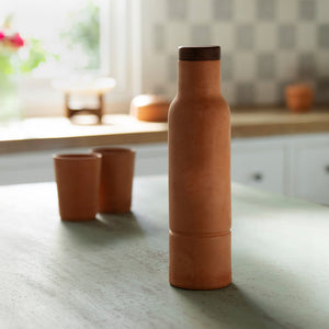 terracotta bottle with wooden lid