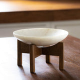 white marble bowl with wooden stand - ellementry