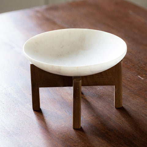 white marble bowl with wooden stand - ellementry