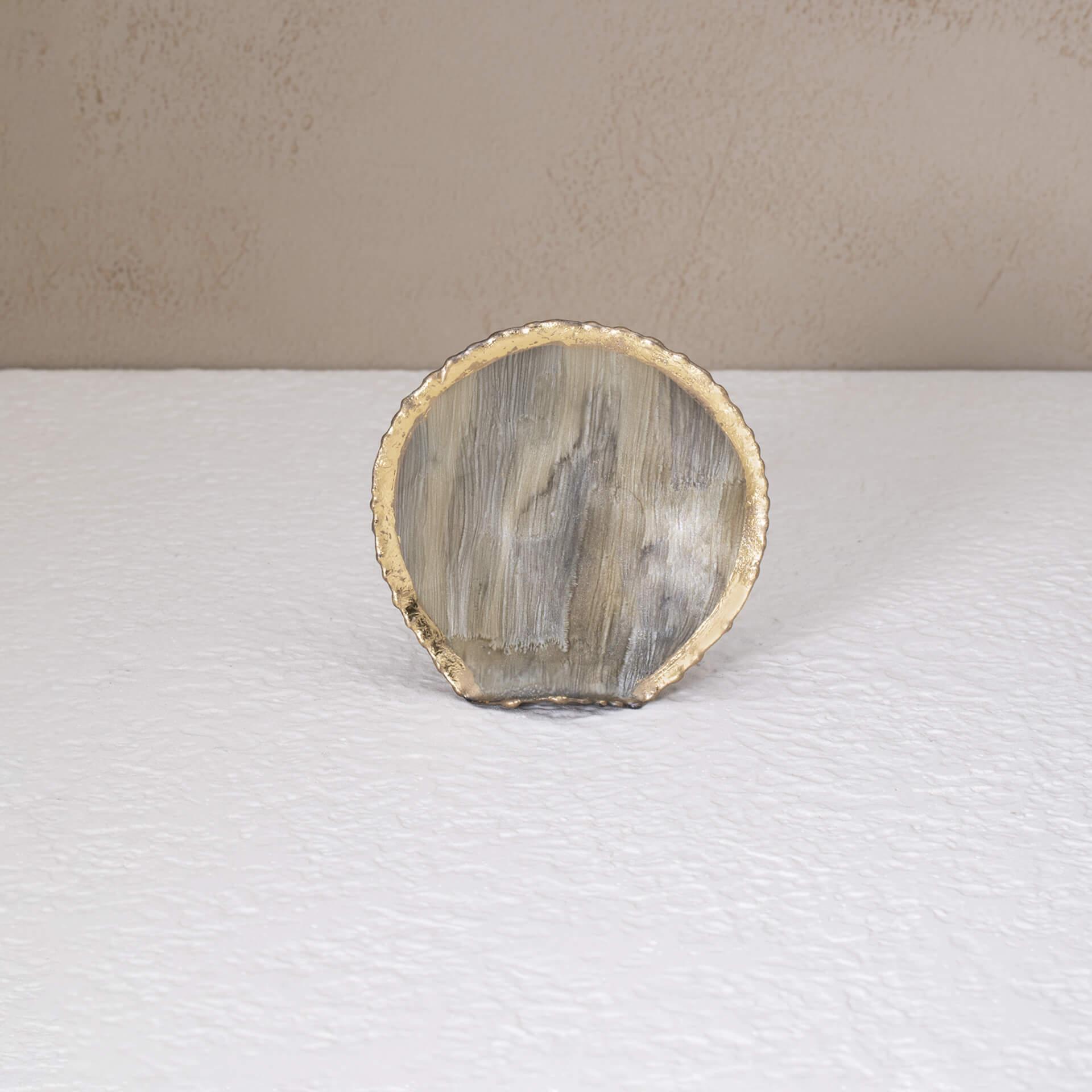 beige round metal napkin ring