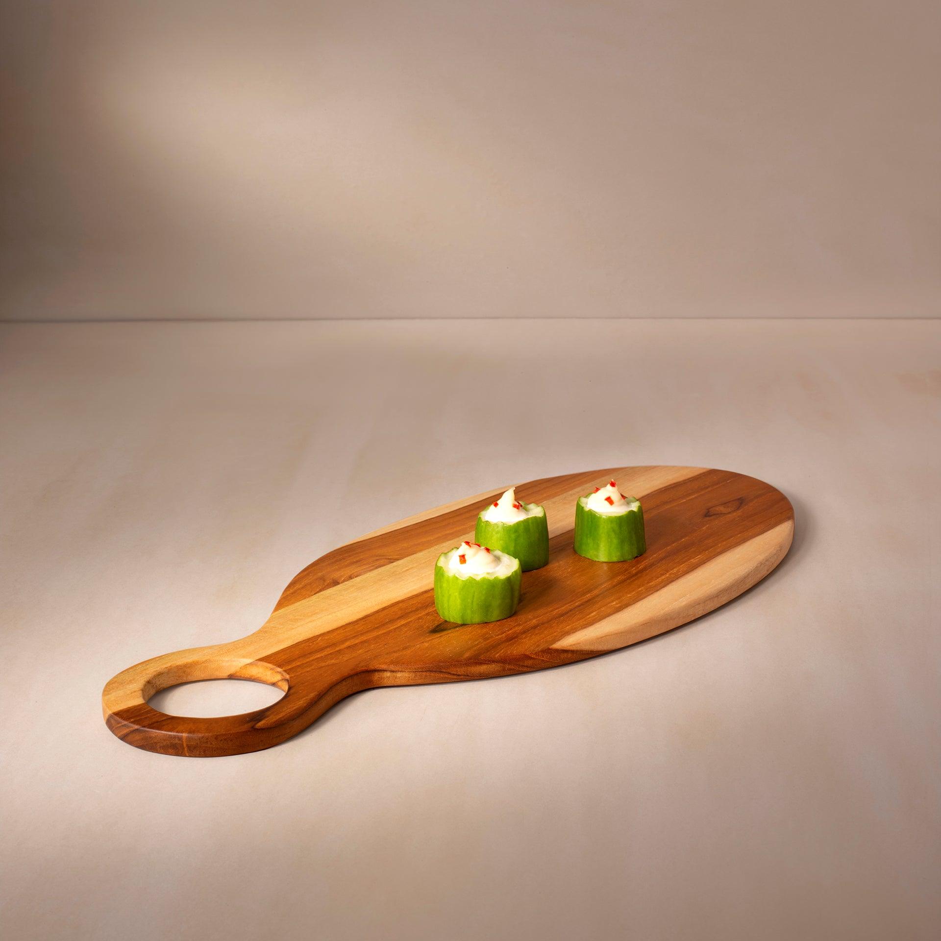 in teak wooden cheese/bread board oval