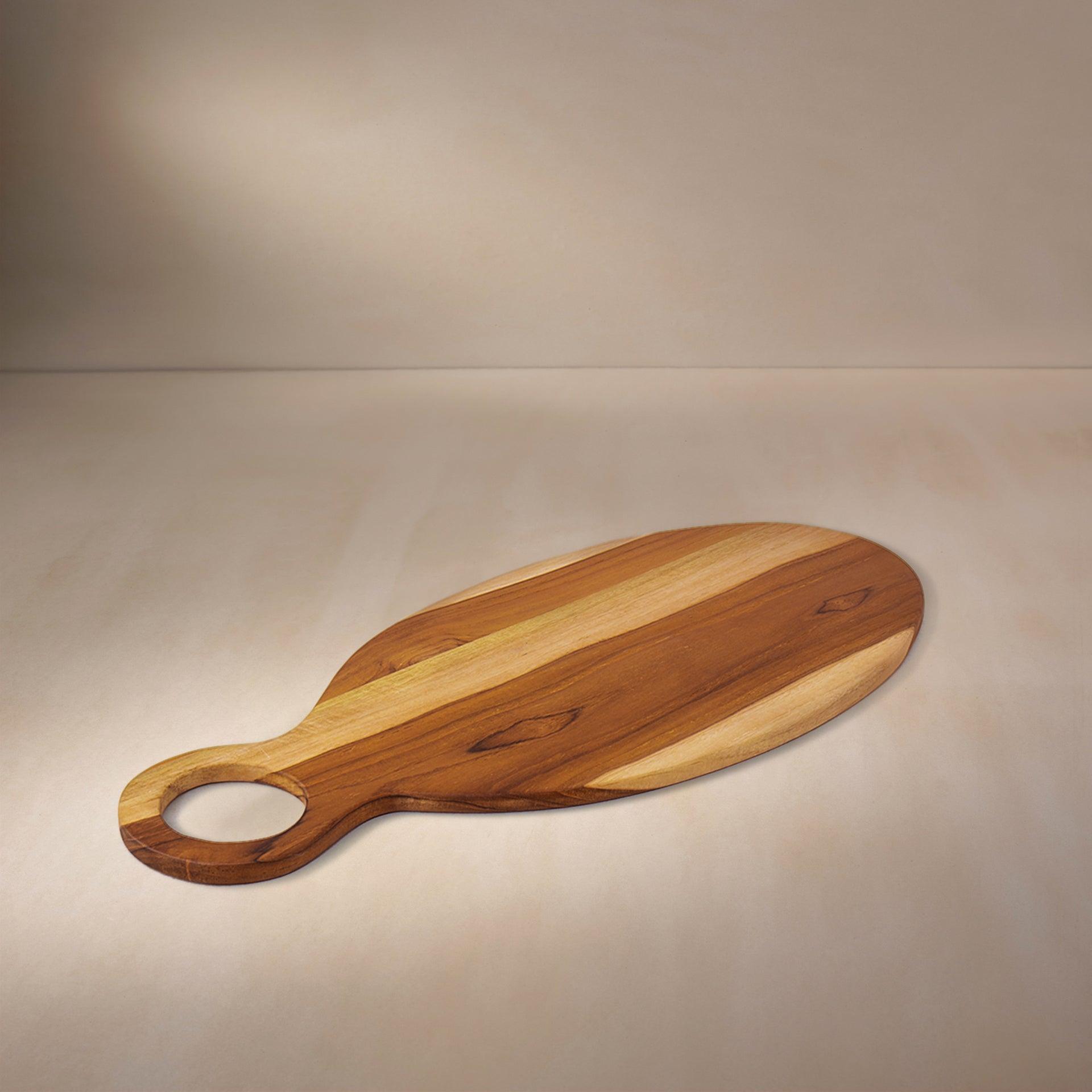 in teak wooden cheese/bread board oval