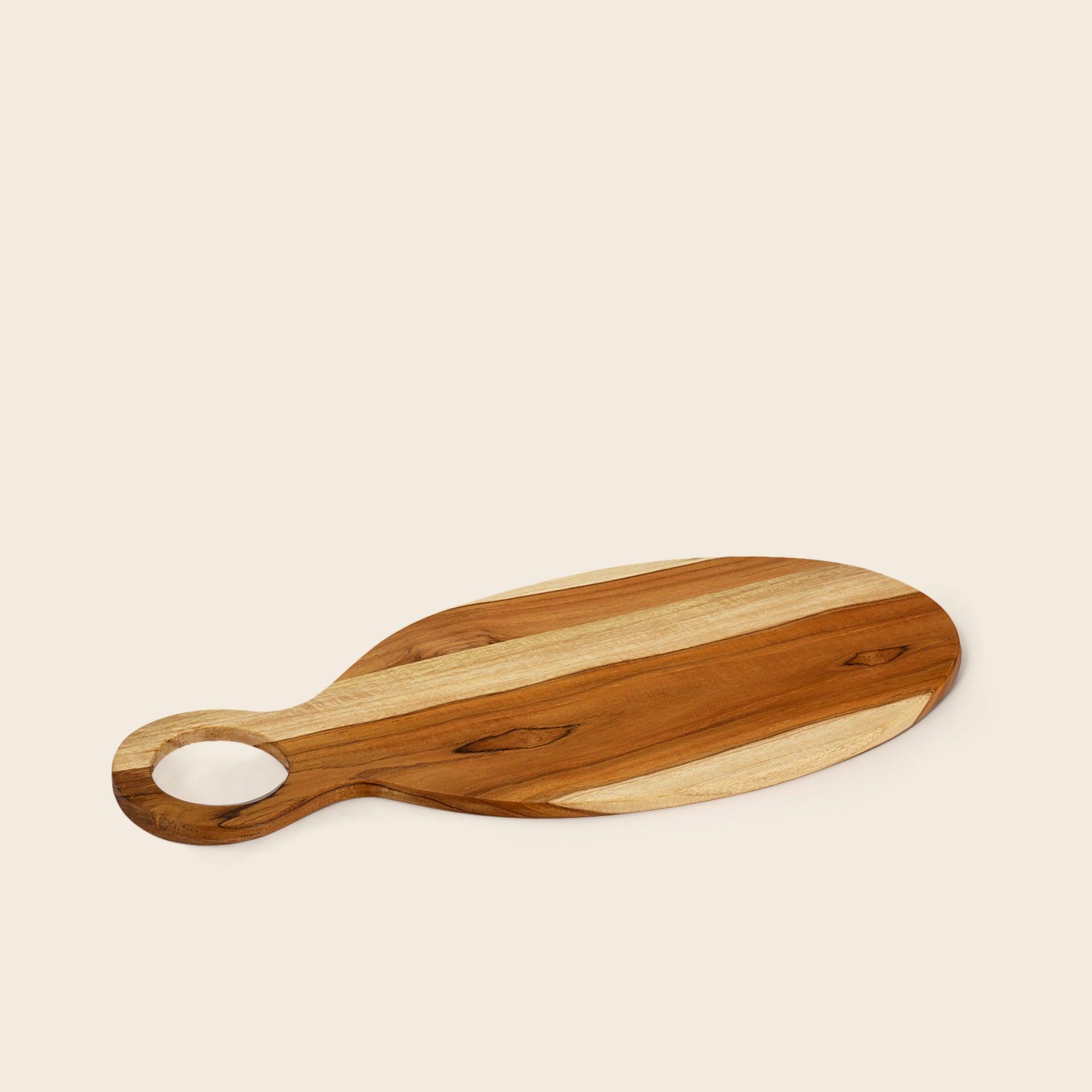 in teak wooden cheese/bread board oval