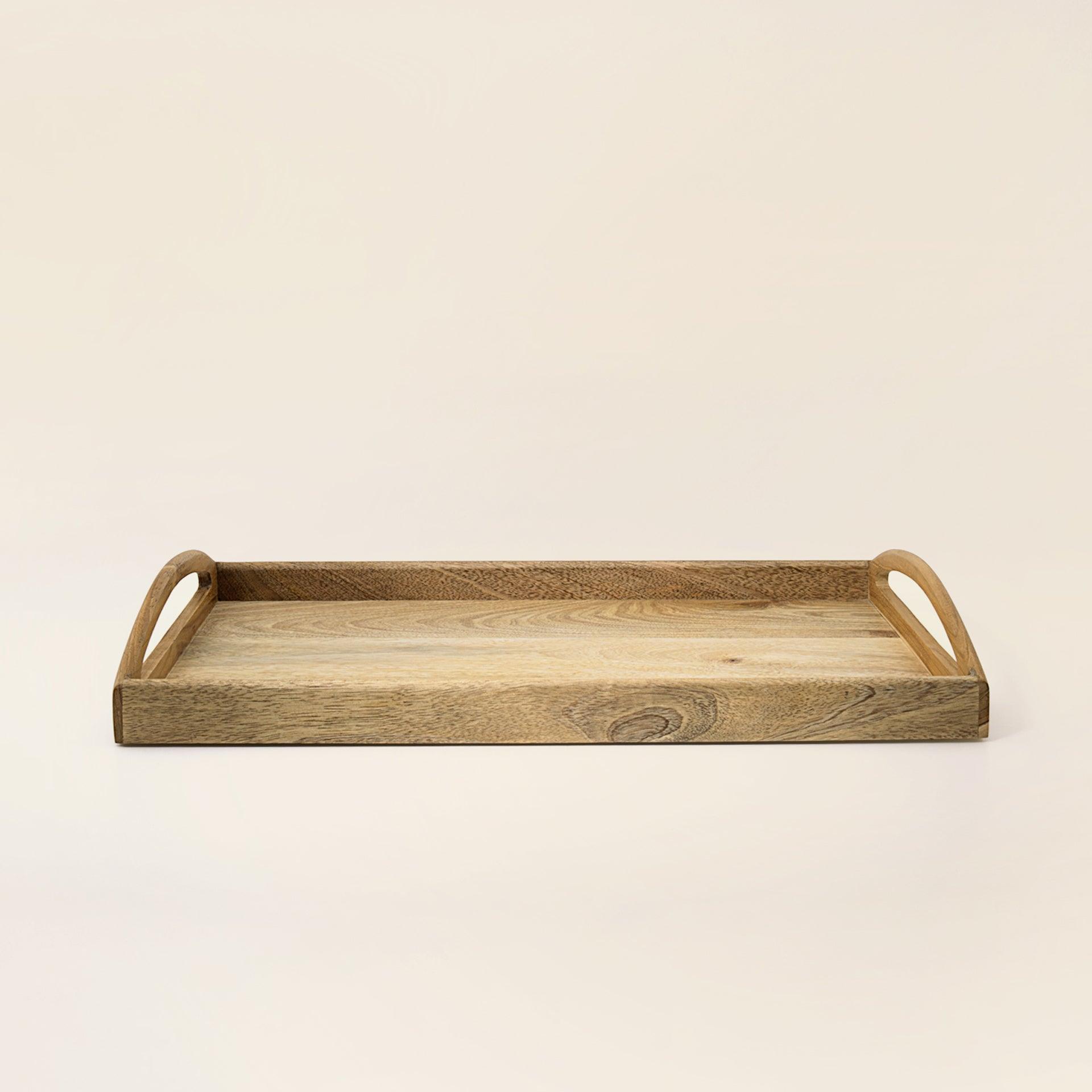 in teak wooden tray